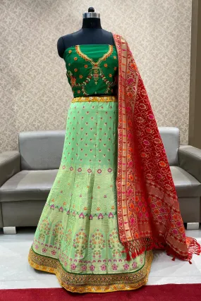 Green Banarasi Semi-Stitched Lehenga with Contrast Red Duppata